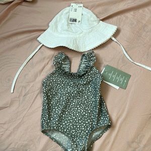 NEVER WORN,BRAND NEW. girl size 9-12 M green bathing suit & white hat to match